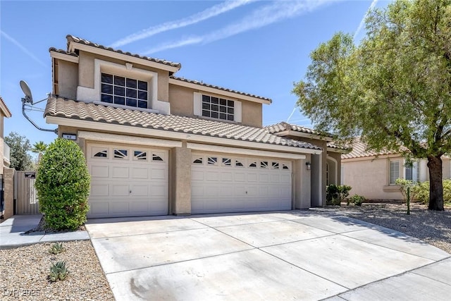 12 Golden View St, Henderson, NV 89012 - mediterranean / spanish-style home with a tiled roof, driveway, stucco siding, and a garage