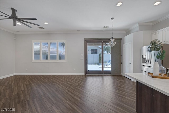 12 Golden View St, Henderson, NV 89012 - unfurnished living room featuring dark wood-style flooring, a chandelier, ceiling fan, recessed lighting, and crown molding