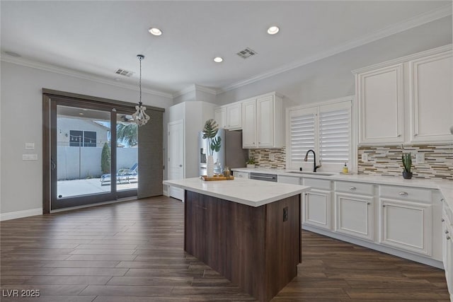 12 Golden View St, Henderson, NV 89012 - kitchen with stainless steel appliances, dark wood-type flooring, a center island, white cabinets, and recessed lighting