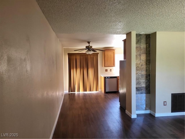 745 Greenbriar Townhouse Way, Las Vegas, NV 89121 - empty room with dark wood-style floors, a ceiling fan, and a textured ceiling