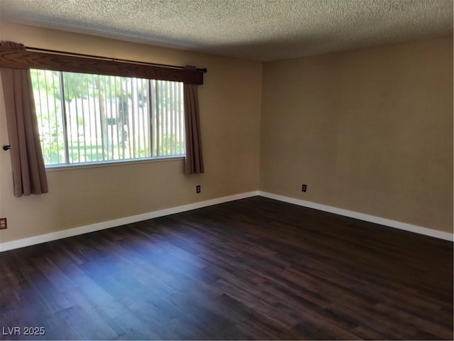 745 Greenbriar Townhouse Way, Las Vegas, NV 89121 - unfurnished room with dark wood-style flooring and a textured ceiling