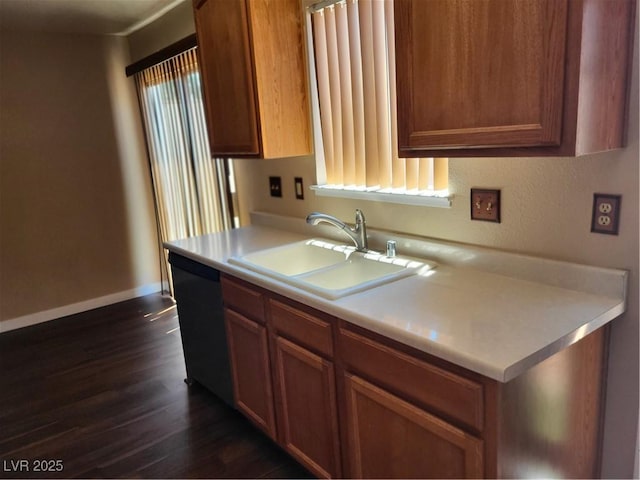 745 Greenbriar Townhouse Way, Las Vegas, NV 89121 - kitchen with dishwasher, dark wood-style flooring, light countertops, and brown cabinets