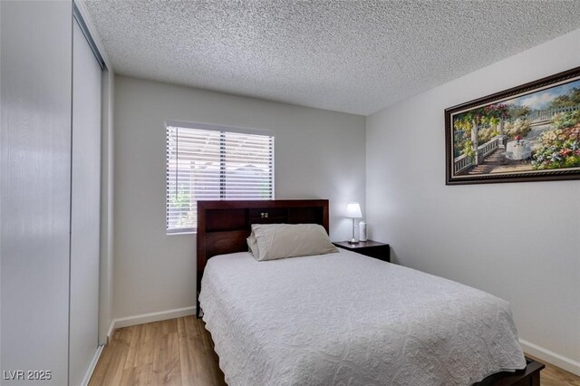 368 Umbria Way, Henderson, NV 89014 - bedroom featuring wood finished floors and a textured ceiling