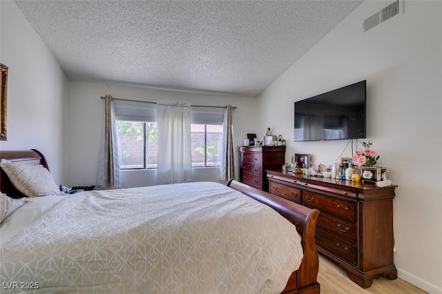 368 Umbria Way, Henderson, NV 89014 - bedroom with a textured ceiling and light wood-style floors