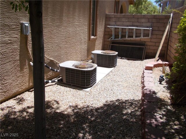 11832 Arenoso Dr, Las Vegas, NV 89138 - exterior view of a central air condition unit and stucco siding