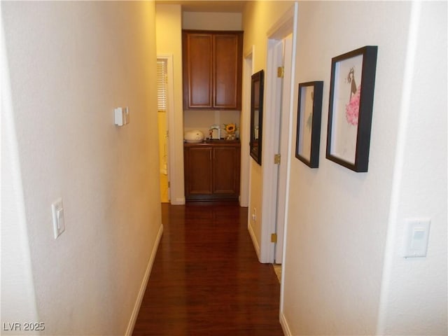 11832 Arenoso Dr, Las Vegas, NV 89138 - hall with dark wood-style flooring and baseboards