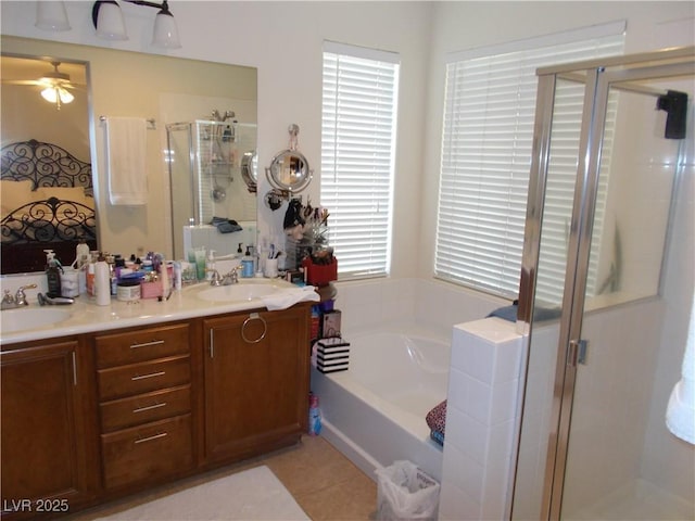 11832 Arenoso Dr, Las Vegas, NV 89138 - bathroom with a stall shower, a garden tub, double vanity, a ceiling fan, and tile patterned floors
