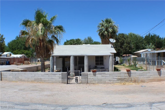 192 W Alma Ave, Overton, NV 89040 - bungalow-style house featuring a fenced front yard, a gate, covered porch, and stucco siding
