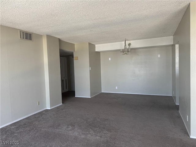3930 University Center Dr Unit 901, Las Vegas, NV 89119 - spare room with dark colored carpet, a textured ceiling, and a chandelier