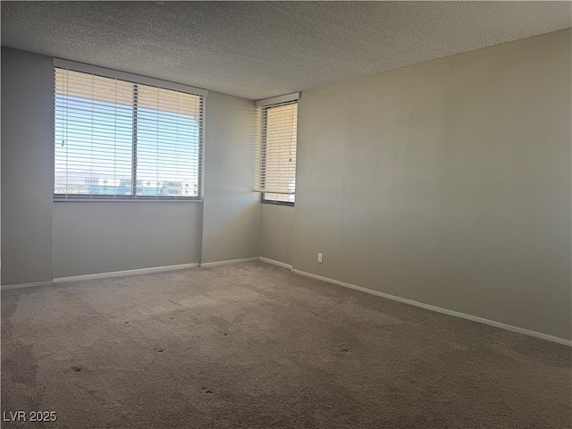 3930 University Center Dr Unit 901, Las Vegas, NV 89119 - carpeted spare room with a textured ceiling and baseboards
