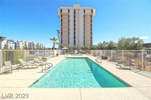3930 University Center Dr Unit 901, Las Vegas, NV 89119 - community pool featuring a patio area