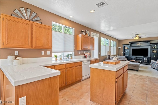 2366 Brockton Way, Henderson, NV 89074 - kitchen featuring dishwasher, healthy amount of natural light, open floor plan, light tile patterned flooring, and recessed lighting