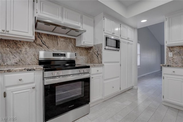1516 Frandosa Ln, Las Vegas, NV 89117 - kitchen with appliances with stainless steel finishes, under cabinet range hood, white cabinets, backsplash, and vaulted ceiling