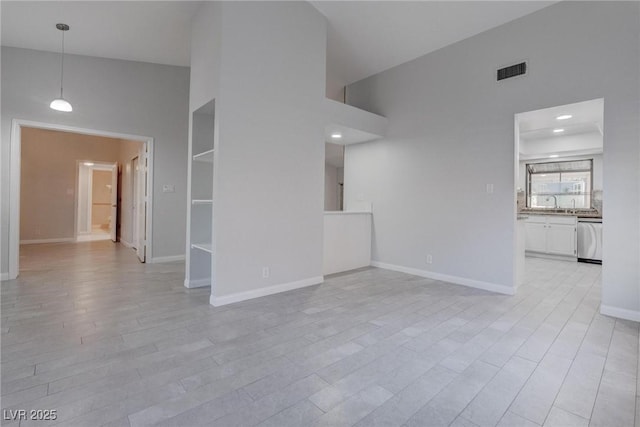 1516 Frandosa Ln, Las Vegas, NV 89117 - unfurnished living room with a towering ceiling and light wood finished floors