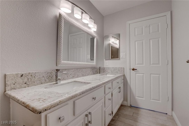 1516 Frandosa Ln, Las Vegas, NV 89117 - full bathroom featuring double vanity and baseboards