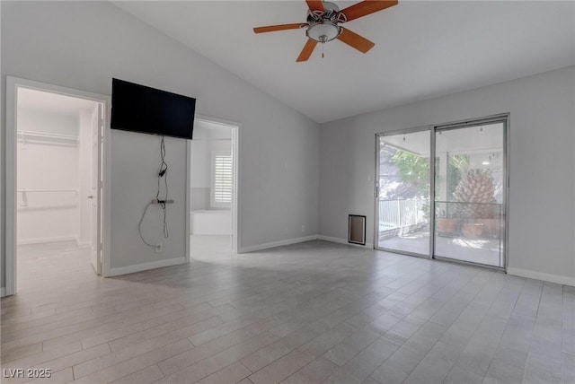 1516 Frandosa Ln, Las Vegas, NV 89117 - unfurnished living room featuring vaulted ceiling, plenty of natural light, ceiling fan, and light wood-type flooring