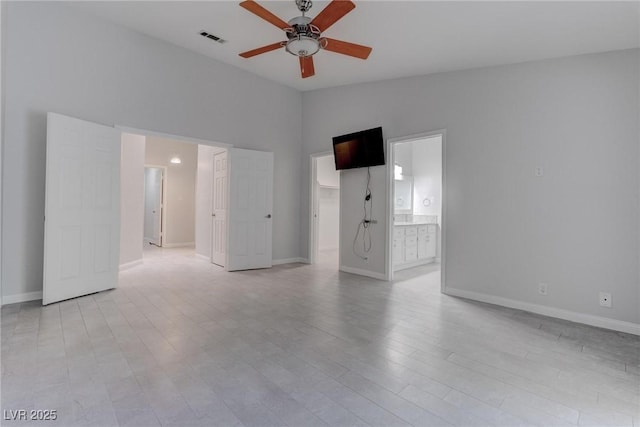 1516 Frandosa Ln, Las Vegas, NV 89117 - unfurnished living room featuring a ceiling fan, lofted ceiling, and light wood-type flooring