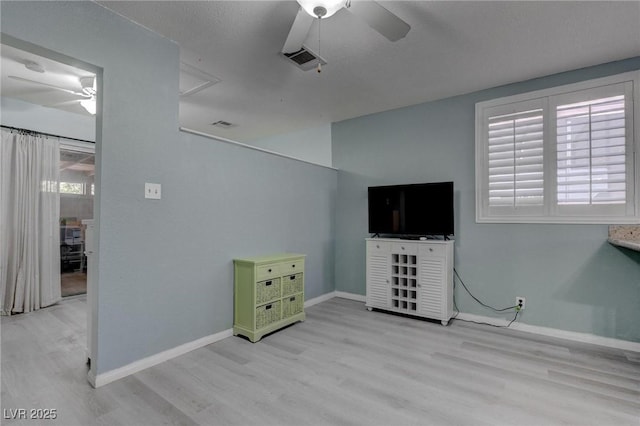 1516 Frandosa Ln, Las Vegas, NV 89117 - unfurnished living room featuring ceiling fan, wood finished floors, and plenty of natural light
