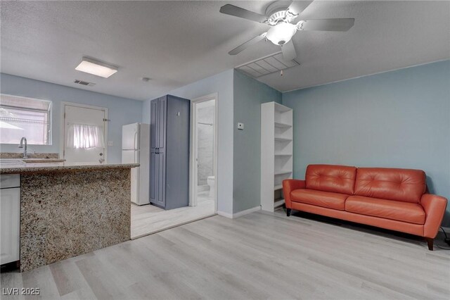 1516 Frandosa Ln, Las Vegas, NV 89117 - living room featuring light wood finished floors and ceiling fan