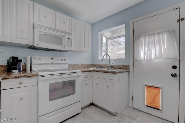 1516 Frandosa Ln, Las Vegas, NV 89117 - kitchen featuring white appliances, white cabinetry, light stone countertops, and light marble finish floors