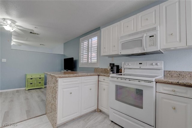 1516 Frandosa Ln, Las Vegas, NV 89117 - kitchen featuring white appliances, white cabinetry, and a peninsula