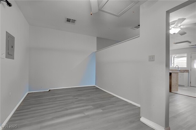 1516 Frandosa Ln, Las Vegas, NV 89117 - additional living space with ceiling fan, electric panel, wood finished floors, and attic access