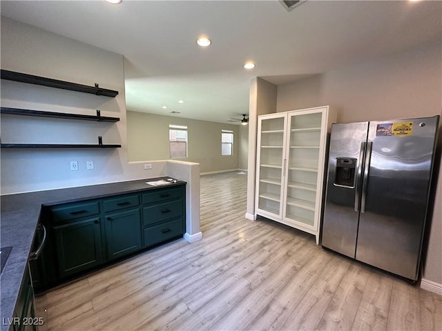 7537 Brisa Del Mar Ave, Las Vegas, NV 89179 - kitchen with stainless steel refrigerator with ice dispenser, a ceiling fan, open shelves, light wood finished floors, and recessed lighting