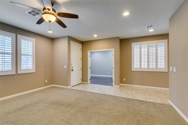 11063 Mount George St, Las Vegas, NV 89179 - spare room with light carpet, ceiling fan, recessed lighting, and light tile patterned flooring