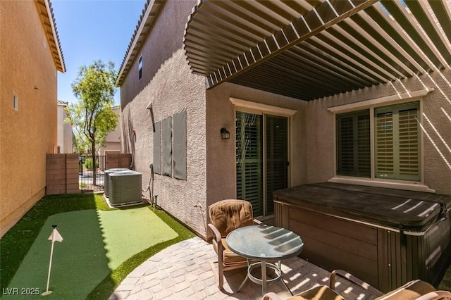 11063 Mount George St, Las Vegas, NV 89179 - view of patio with a hot tub and a putting area
