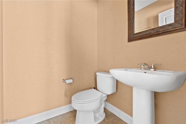 9175 Titan Hill Ct, Las Vegas, NV 89148 - half bath with toilet and tile patterned floors