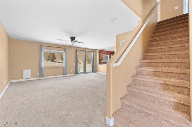 9175 Titan Hill Ct, Las Vegas, NV 89148 - stairway featuring a ceiling fan and carpet floors