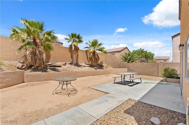 9175 Titan Hill Ct, Las Vegas, NV 89148 - fenced backyard featuring a patio area