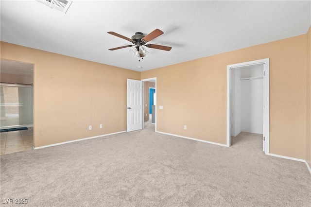 9175 Titan Hill Ct, Las Vegas, NV 89148 - unfurnished bedroom with carpet floors, a walk in closet, a closet, and ceiling fan