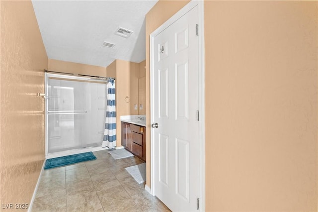 9175 Titan Hill Ct, Las Vegas, NV 89148 - bathroom featuring curtained shower, vanity, and tile patterned flooring