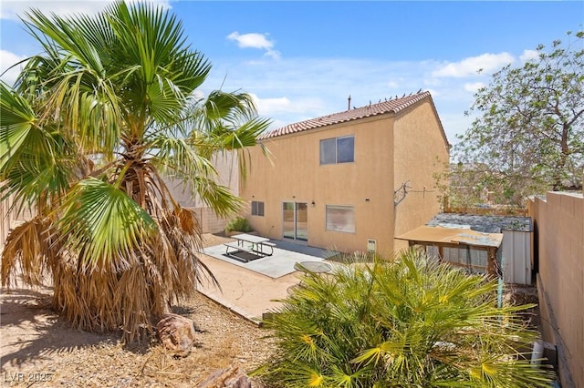 9175 Titan Hill Ct, Las Vegas, NV 89148 - back of house with stucco siding, a patio area, and a tiled roof