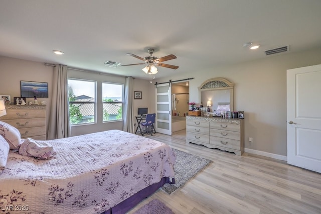 9785 W Meranto Ave, Las Vegas, NV 89178 - bedroom featuring a barn door, light wood-type flooring, a ceiling fan, and recessed lighting