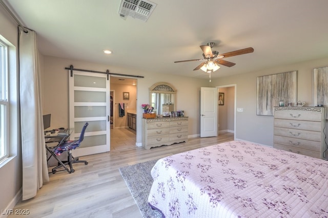 9785 W Meranto Ave, Las Vegas, NV 89178 - bedroom with a barn door, light wood-type flooring, a desk, recessed lighting, and ceiling fan