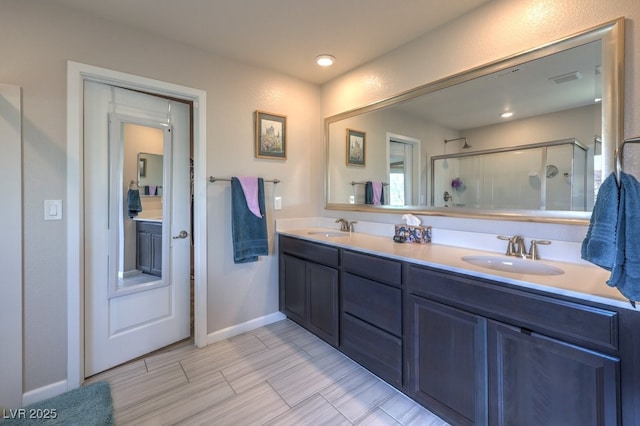 9785 W Meranto Ave, Las Vegas, NV 89178 - full bathroom featuring double vanity and a shower stall