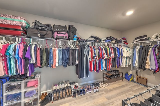 9785 W Meranto Ave, Las Vegas, NV 89178 - walk in closet featuring wood finished floors