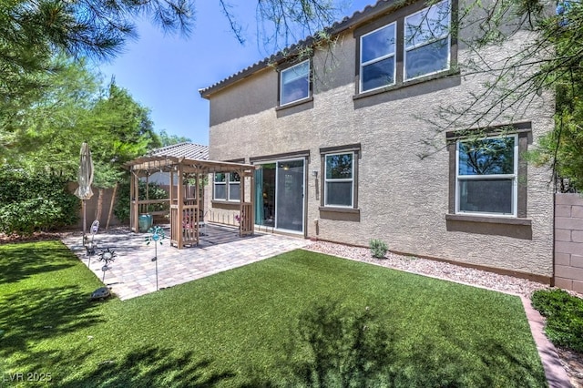9785 W Meranto Ave, Las Vegas, NV 89178 - rear view of house featuring a pergola, stucco siding, a patio area, and a fenced backyard