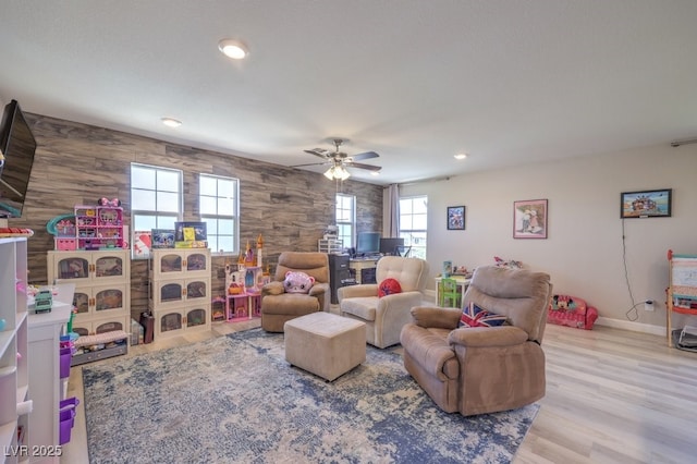9785 W Meranto Ave, Las Vegas, NV 89178 - living area featuring a ceiling fan, recessed lighting, wood finished floors, and wood walls