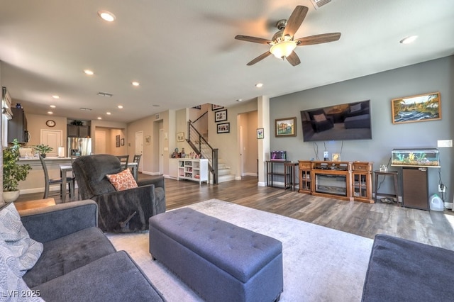 9785 W Meranto Ave, Las Vegas, NV 89178 - living area featuring stairway, wood finished floors, recessed lighting, and a ceiling fan