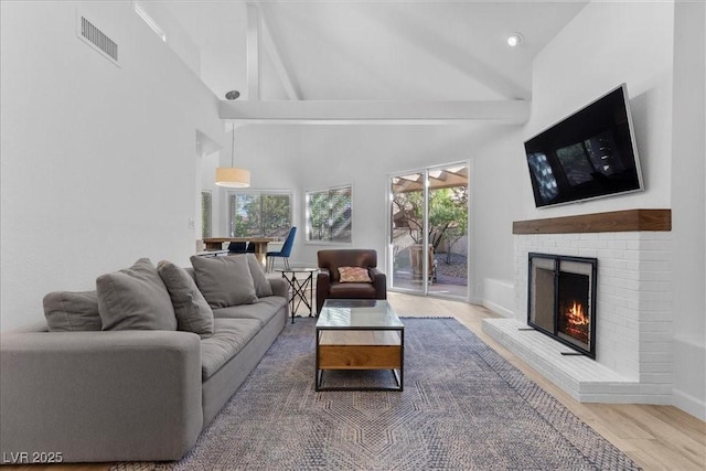 7627 Boca Raton Dr, Las Vegas, NV 89113 - living area with beam ceiling, wood finished floors, a fireplace, high vaulted ceiling, and recessed lighting