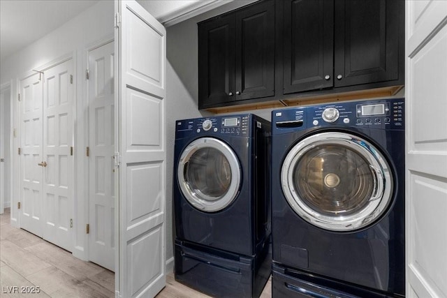 7627 Boca Raton Dr, Las Vegas, NV 89113 - laundry area featuring washing machine and clothes dryer, cabinet space, and light wood-style floors