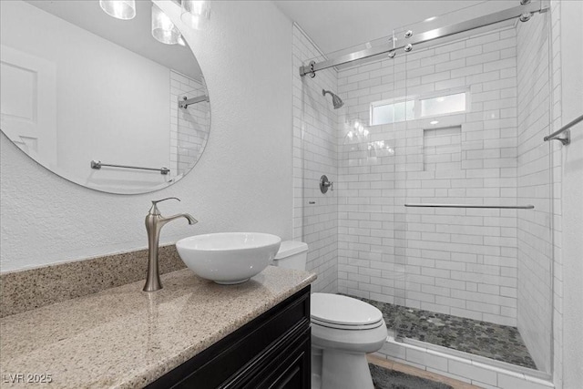 7627 Boca Raton Dr, Las Vegas, NV 89113 - bathroom with vanity, a stall shower, and a textured wall