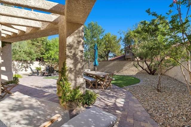 7627 Boca Raton Dr, Las Vegas, NV 89113 - fenced backyard with a patio area, outdoor dining area, and a fire pit