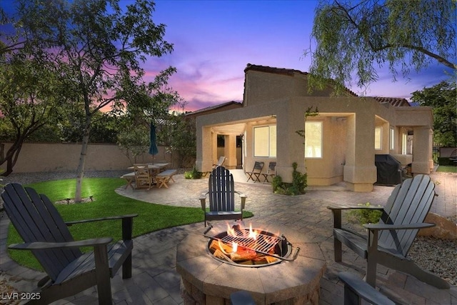 7627 Boca Raton Dr, Las Vegas, NV 89113 - back of house featuring a fire pit, stucco siding, and a patio area