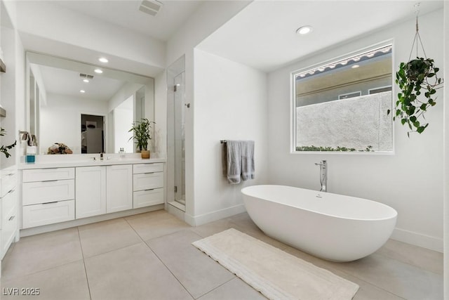 2797 Turtle Head Peak Dr, Las Vegas, NV 89135 - full bathroom with vanity, a freestanding tub, a shower stall, tile patterned flooring, and recessed lighting