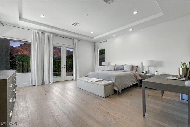 2797 Turtle Head Peak Dr, Las Vegas, NV 89135 - bedroom with a raised ceiling, access to outside, french doors, light wood-style flooring, and recessed lighting