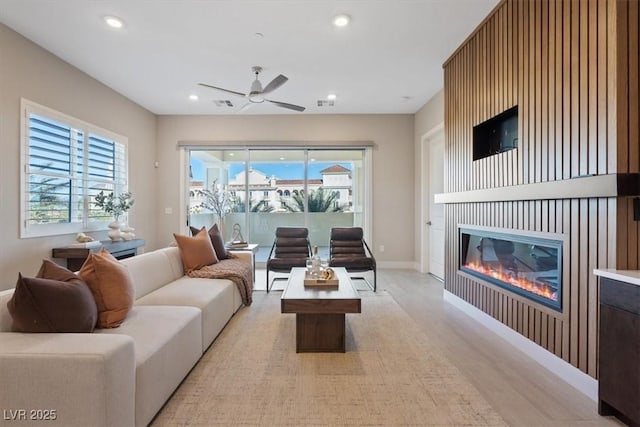 120 Los Cabos Dr Unit 301, Las Vegas, NV 89144 - living room with a ceiling fan, a glass covered fireplace, light wood-style floors, and recessed lighting